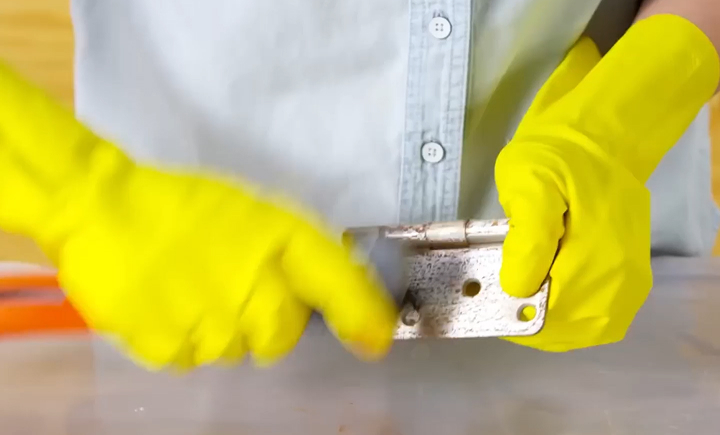 Spray being applied to a corroded fitting